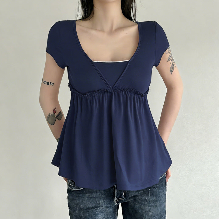 Dame luftig omslagsbluse med elastisk midje og dekorative volangdetaljer Skjora