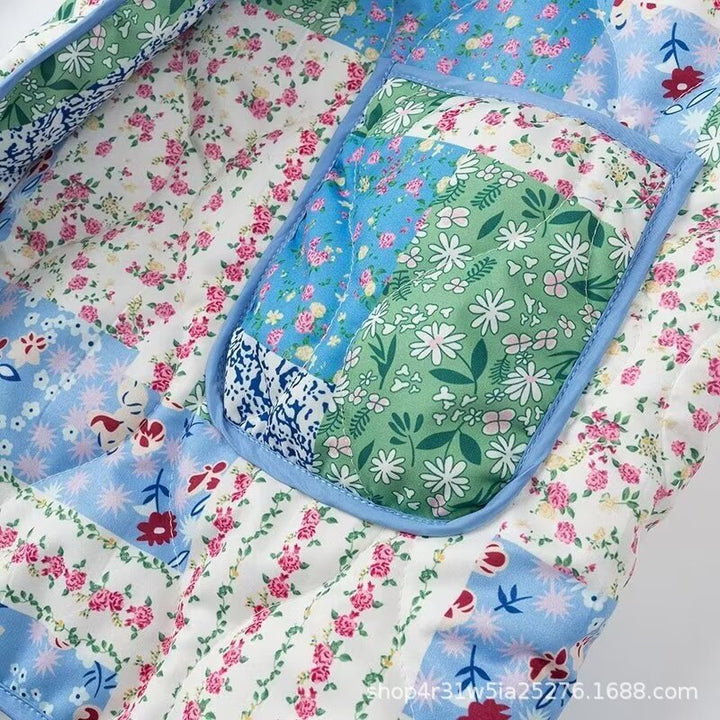 Dames Patchwork Polstret Jakke med Blomstermønster og Praktiske Sidelommer Skjora