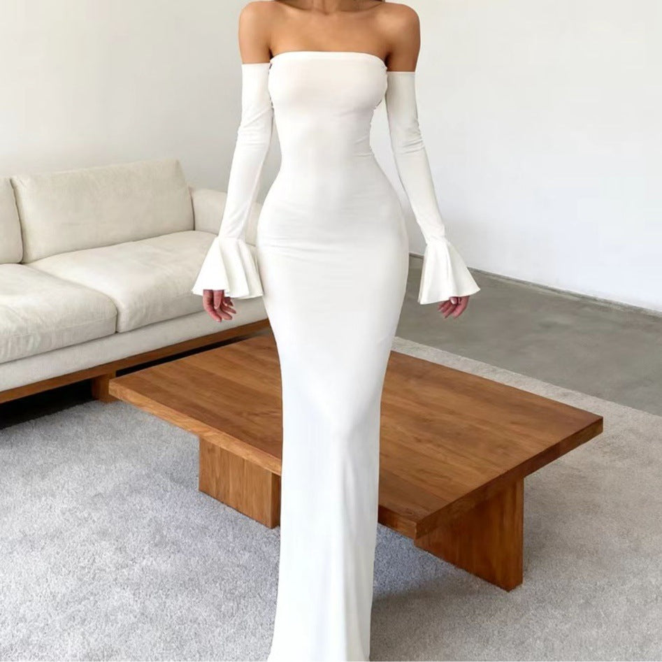 Women's body-hugging off-shoulder evening dress with long sleeves and voluminous cuffs Skjora