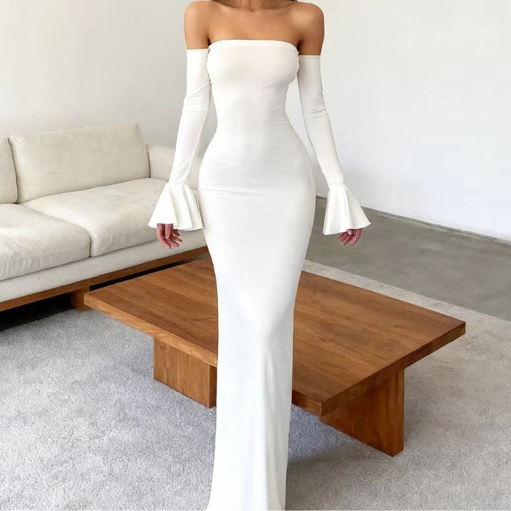 Women's body-hugging off-shoulder evening dress with long sleeves and voluminous cuffs Skjora