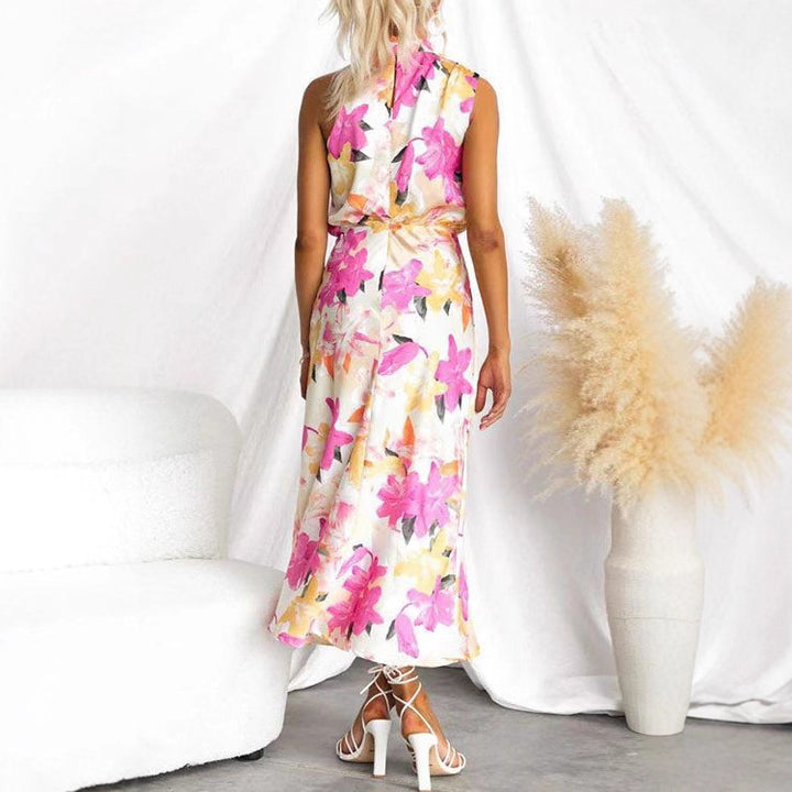 Kvinnens maxi kjole med asymmetrisk topp og blomsterprint Skjora