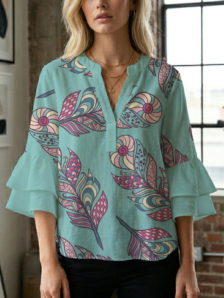 Damebluse med voluminøse puffermer og kreativt blomstermønster Skjora