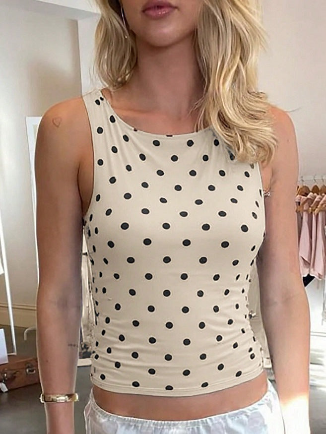Damen ermeløs topp med polka-dotter og figurtilpasset snitt Skjora