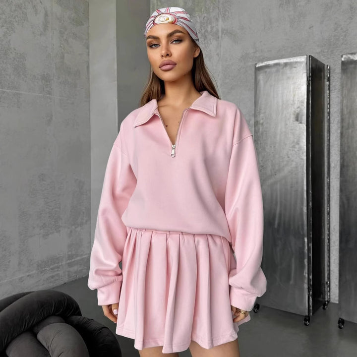 Kvinnors sportiga oversized pullover med kort dragkedja och ribbade avslut Skjora