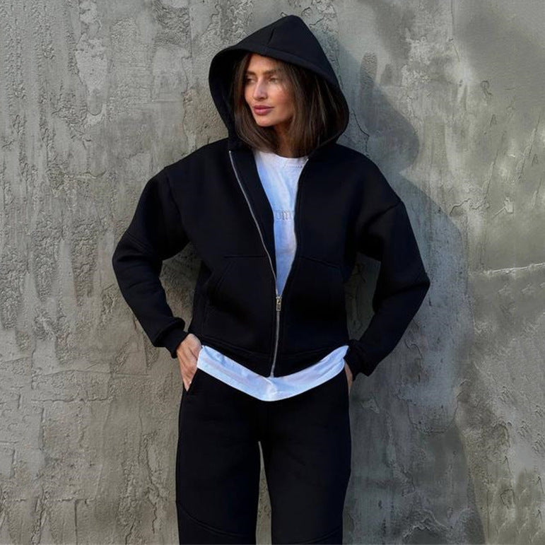 Kvinnenes sport fleece jumpsuit med hette og glidelås Skjora