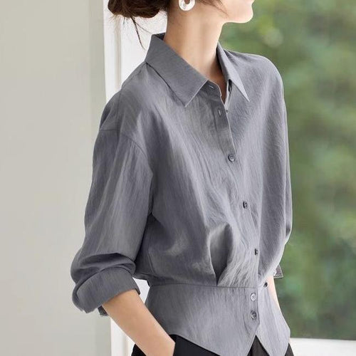 Kvinnes elegant oversized bluse med livbelte Skjora