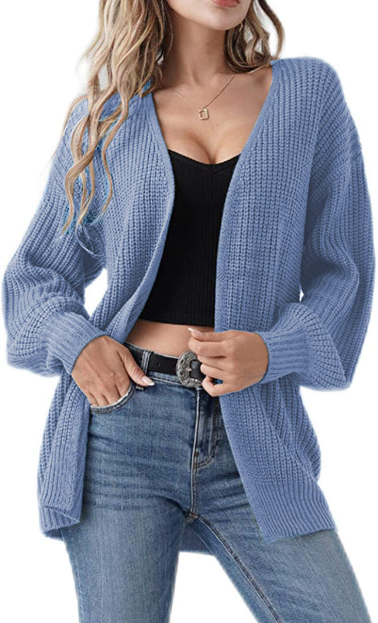 Kvinnens chunky strikket cardigan med en avslappet fasong og åpne masker Skjora
