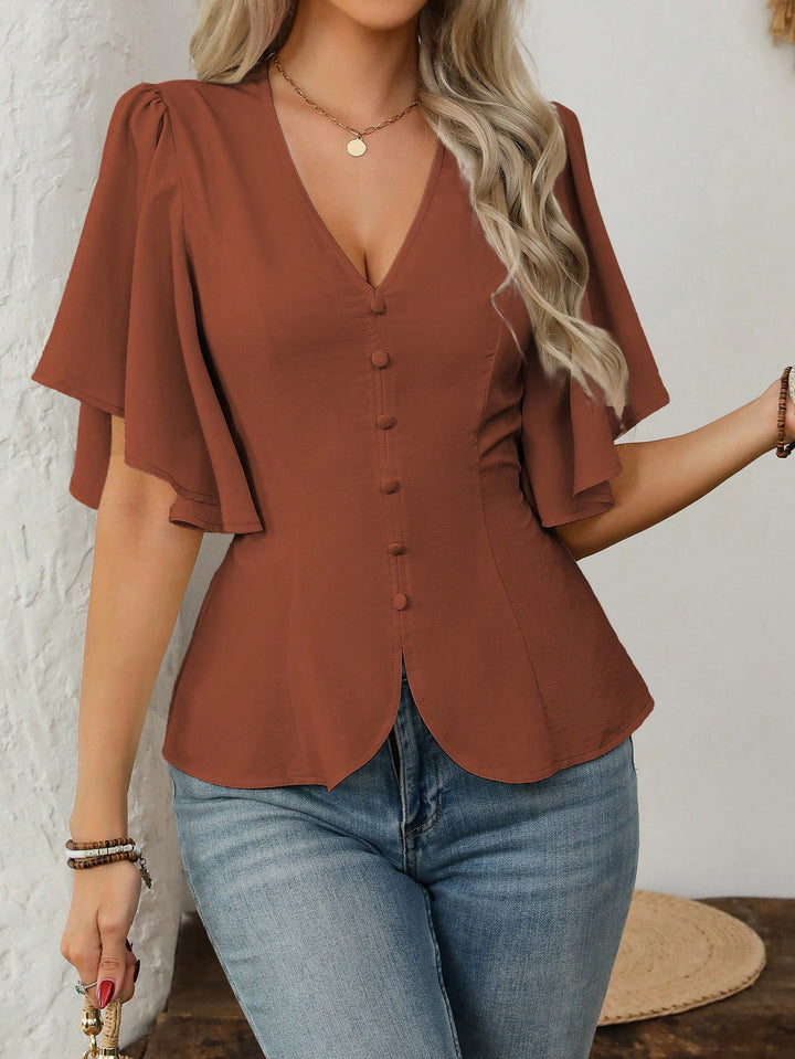 Dame elegant bluse med klokkeermer og knappdetalj Skjora