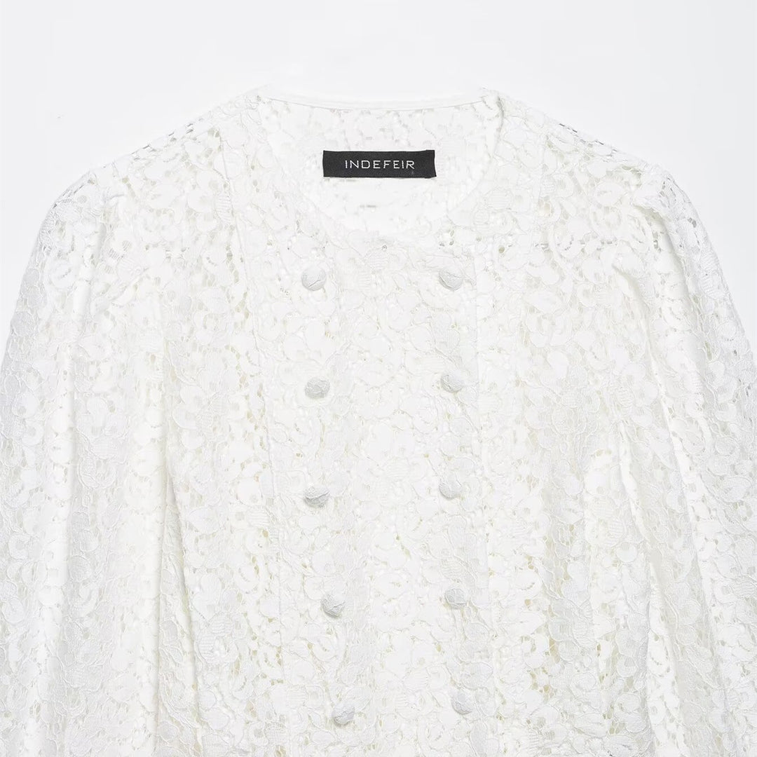 Dame spissbluse med dekorative knapper og elegant passform Skjora