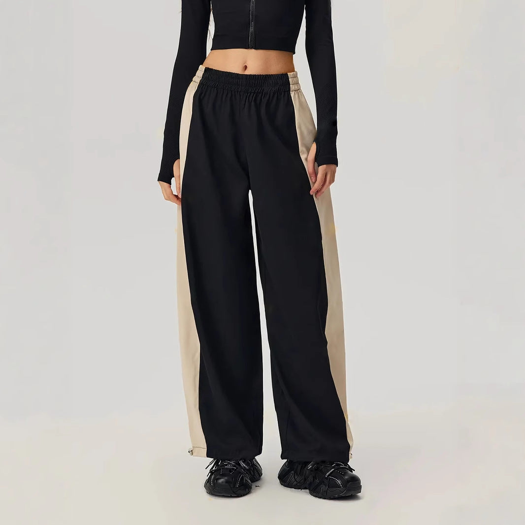 Kvinnenes sporty fritidsbukser med trendy snitt og sidekontrastpaneler Skjora