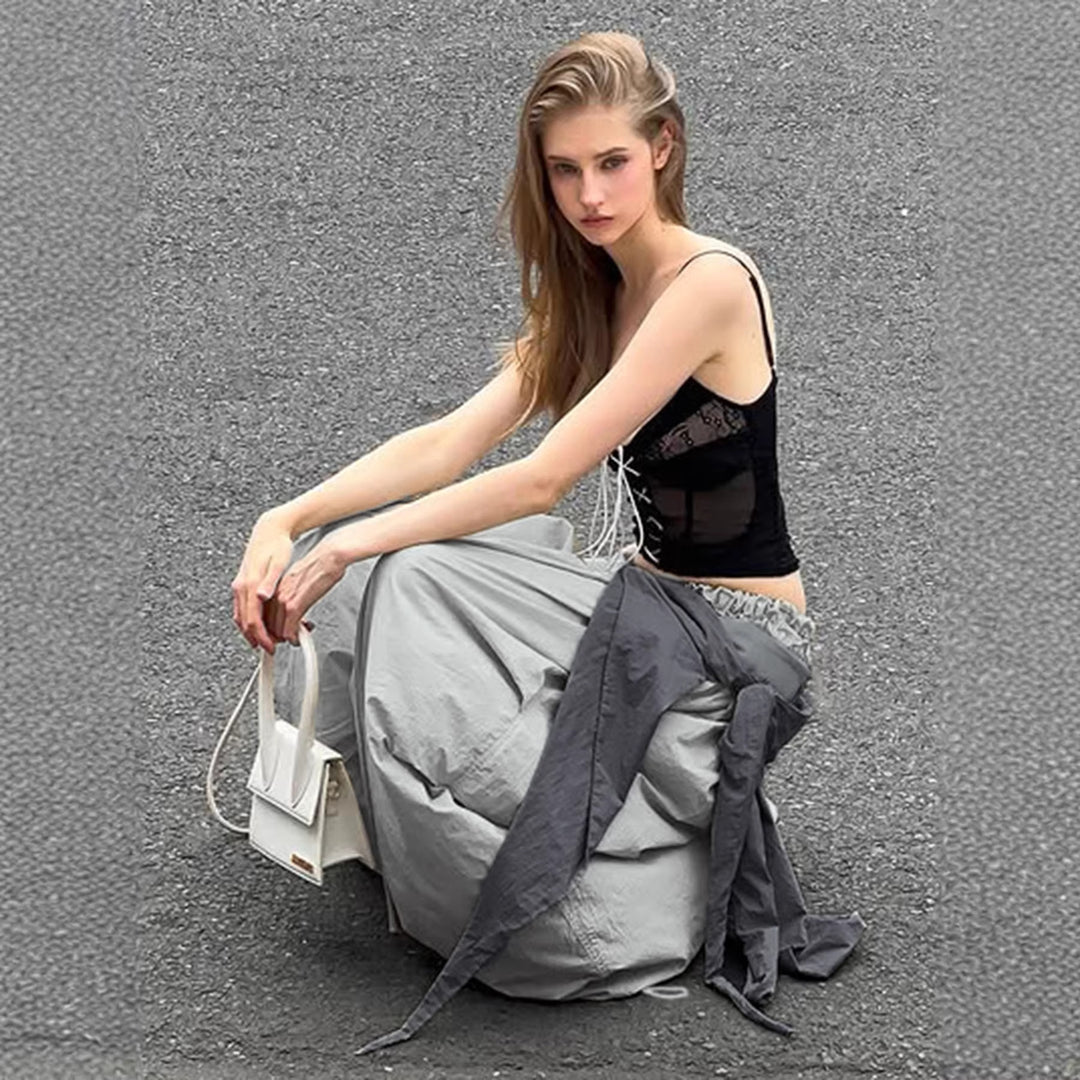 Dame modische High-Waist-bukse med asymmetrisk design og sidelivsnedbinding Skjora
