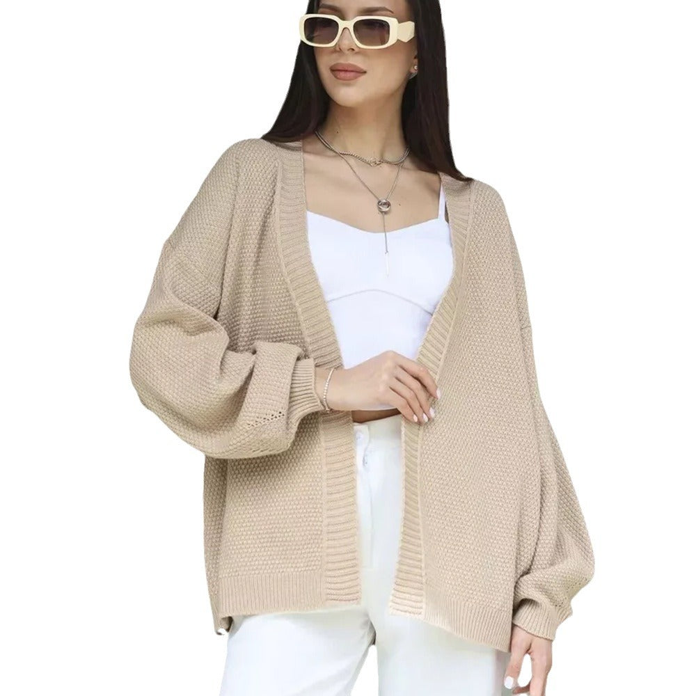 Kvinne oversized poncho med teksturert mønster og vide ermer Skjora