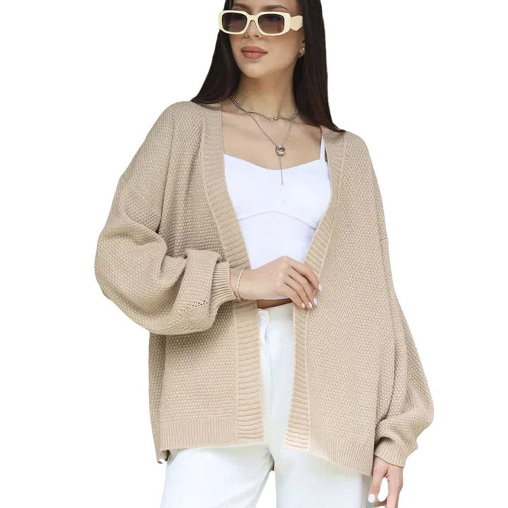 Kvinne oversized poncho med teksturert mønster og vide ermer Skjora