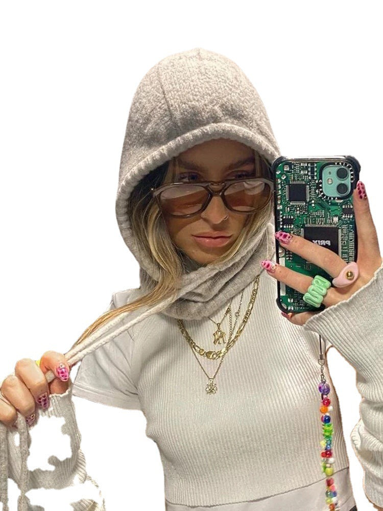 Ladies fashionably knitted top with hood and long sleeves Skjora
