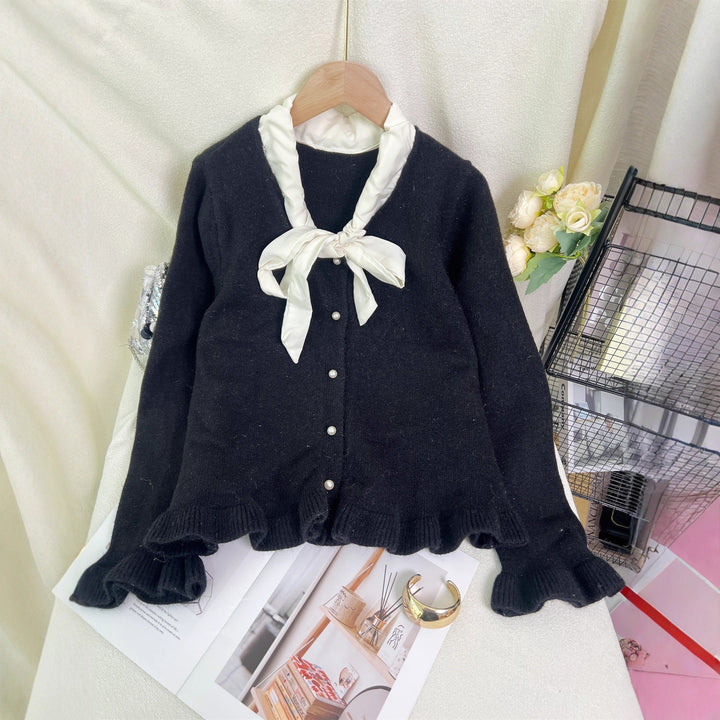 Kvinnes elegant cardigan med volanger og sløyfekrage Skjora