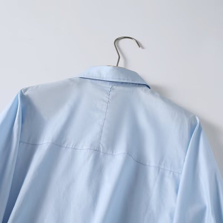 Dame elegant langermet bluse med moderne detaljer og strukturert stoff Skjora