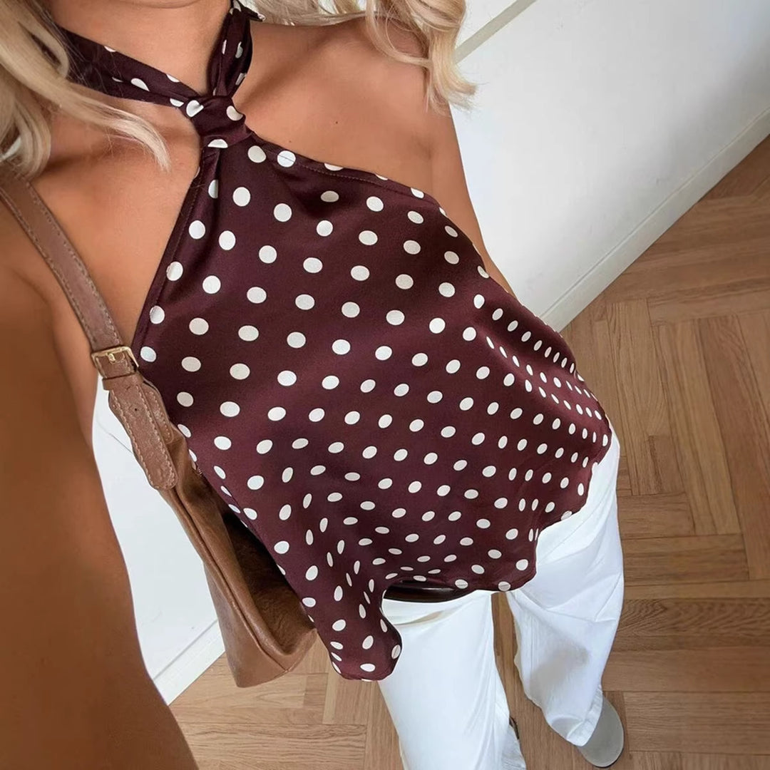 Damer Elegant topp med avskjært design og lekent prikkmønster Skjora