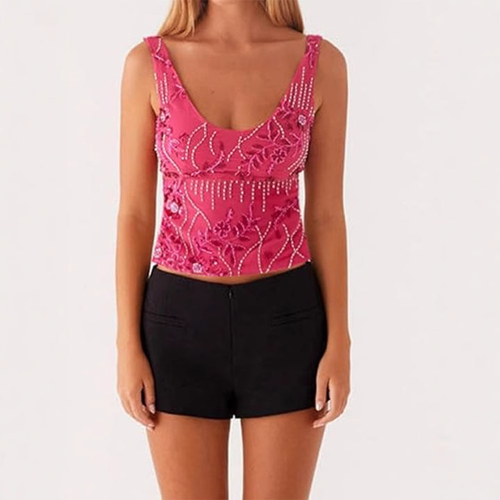 Damescouture topp med blomstret rhinestonesdesign og tettsittende snitt