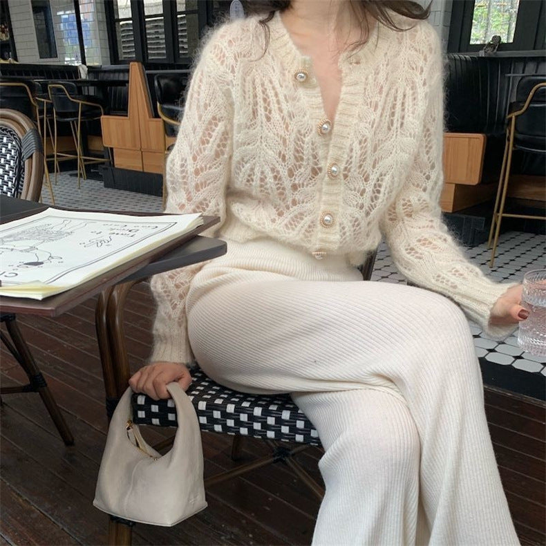 Dame cardigan med åpenmønster og elegante knapppdetaljer Skjora