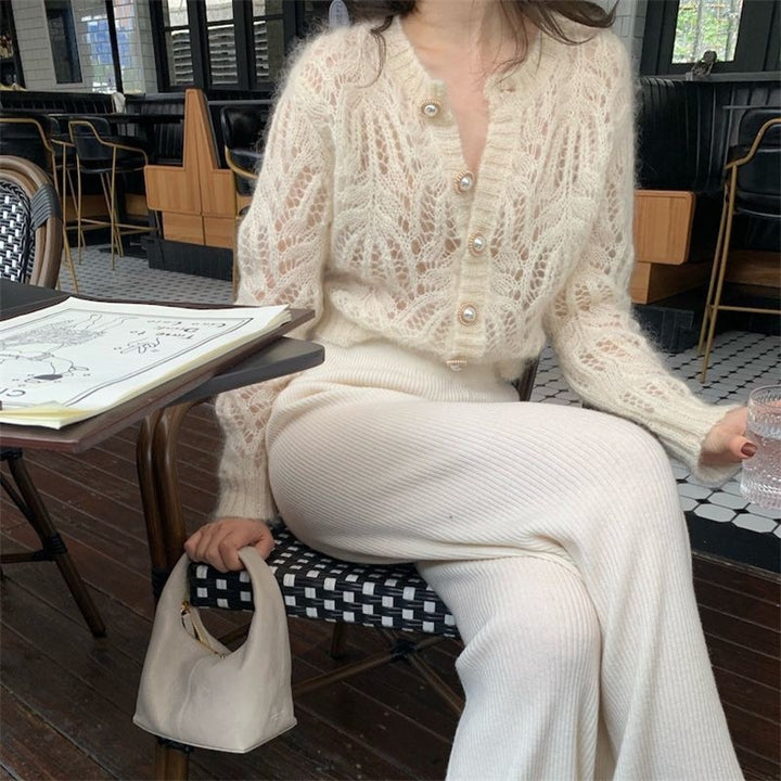 Dame cardigan med åpenmønster og elegante knapppdetaljer Skjora