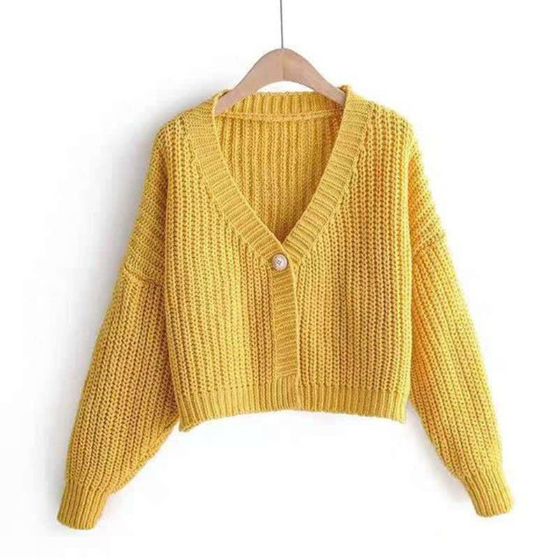 Kvinnens chunky strikket cardigan med løs passform og dekorativ V-hals Skjora