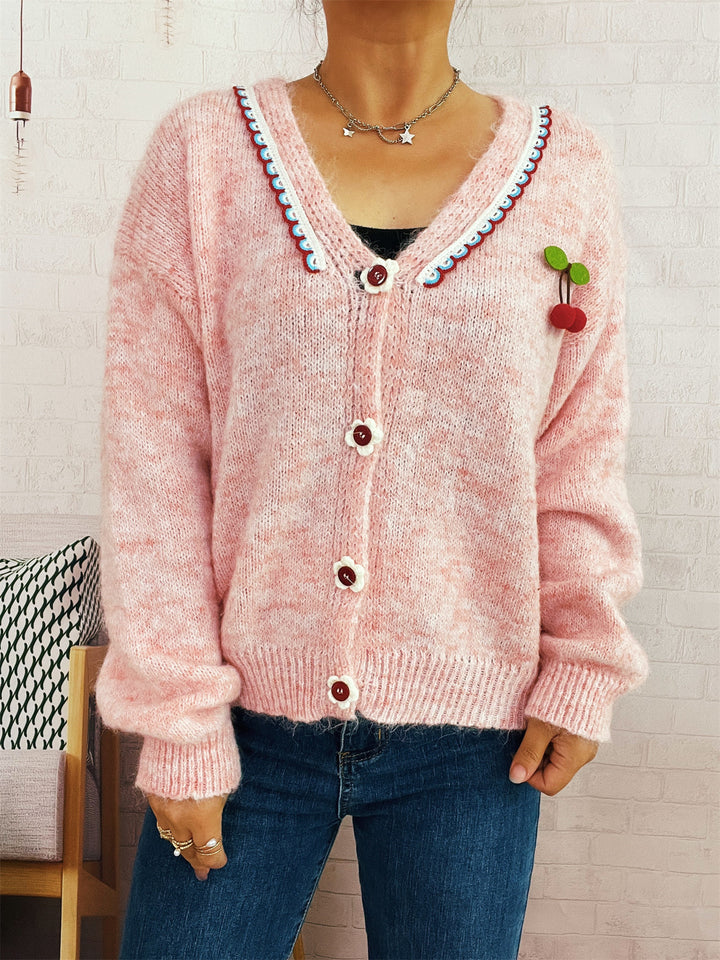 Dame koselig cardigan med lekent blomsterdesign og knappedetaljer Skjora