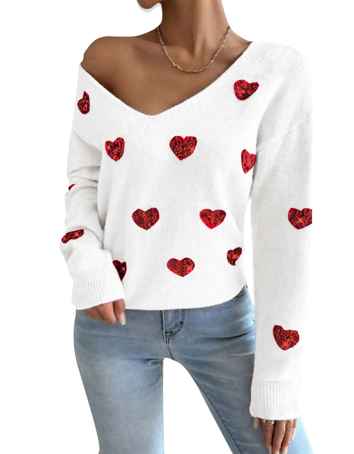 Kvinnelig oversized genser med dyp V-hals og hjerte motiver Skjora