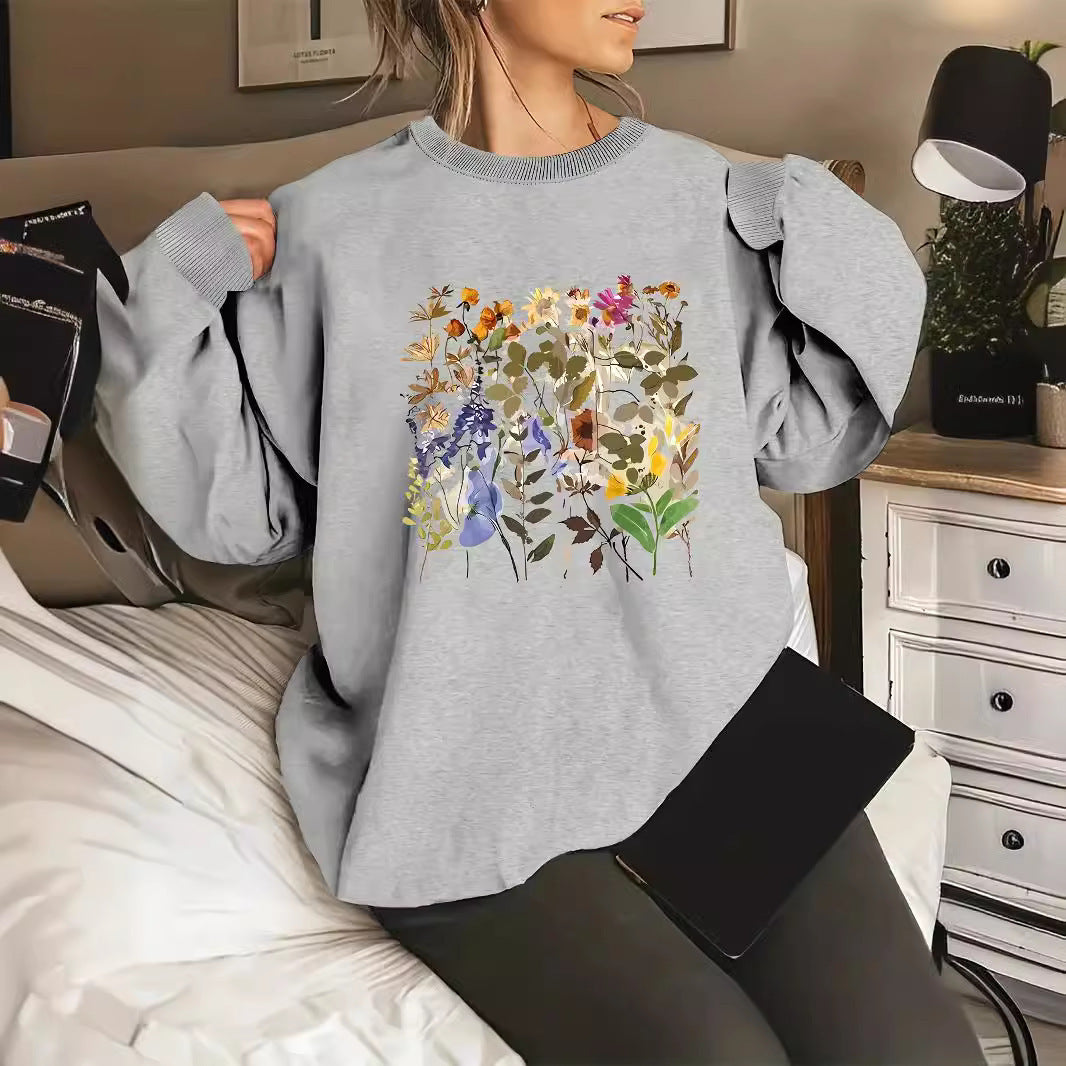 Dame sweatshirt med blomsterdesign og komfortabel passform Skjora