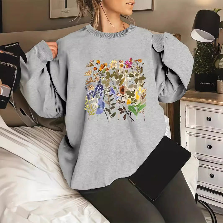 Dame sweatshirt med blomsterdesign og komfortabel passform Skjora