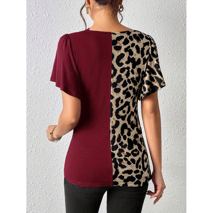 Dame Trendy topp med asymmetrisk design og raffinerte cut-outs Skjora