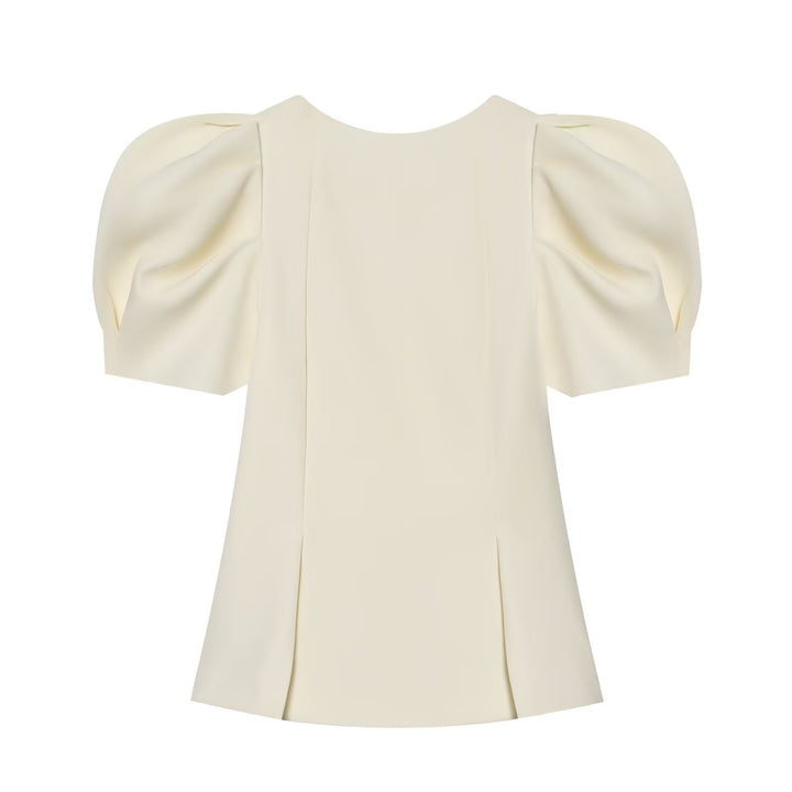 Damebluse med puffarmer og elegant snitt Skjora