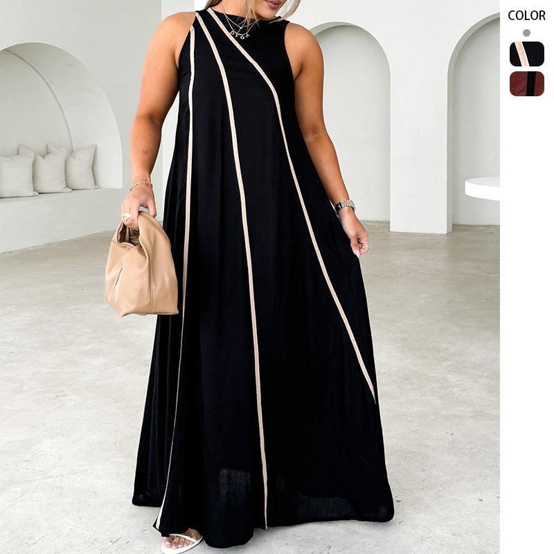 Kvinne maxi kjole med asymmetrisk design og elegante kontrast sømmer