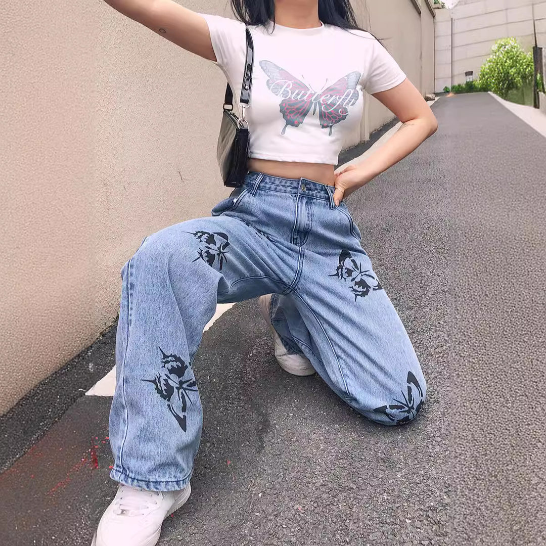 Dame vide jeans med iøynefallende sommerfugltrykk Skjora