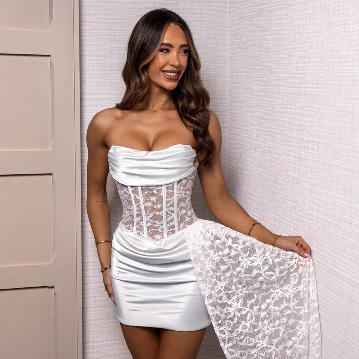 Women's corset-inspired mini dress with elegant lace and flowy skirt