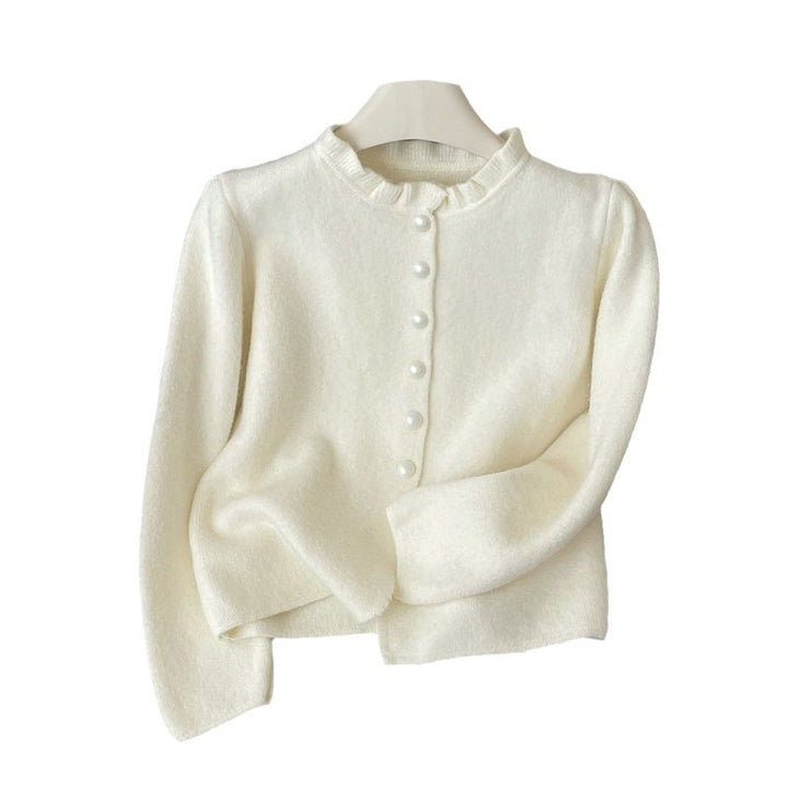 Damer elegant cardigan med feminine volanger og perleknapper Skjora