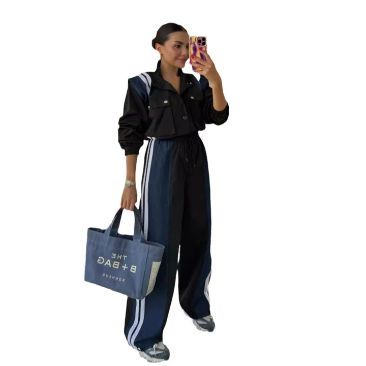 Women's sporty jumpsuit with sophisticated drawstring detail at the waist and contrasting stripes on the skirt