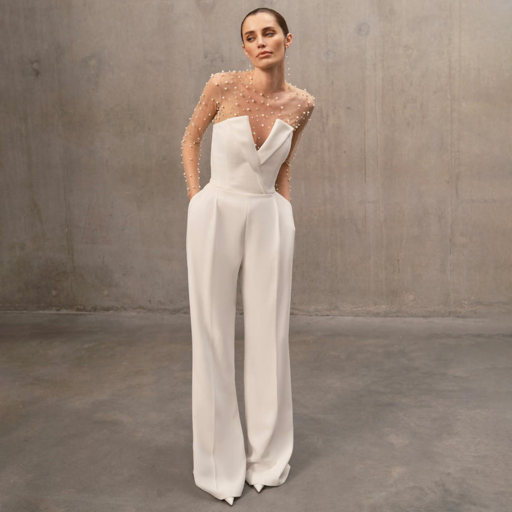 Damer elegant jumpsuit med transparente ermer og perlepynt Skjora