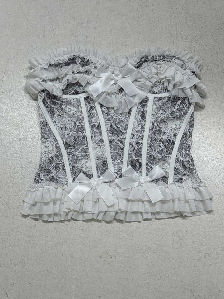 Dame spiss-bustier med volangdetaljer og sløyfer Skjora