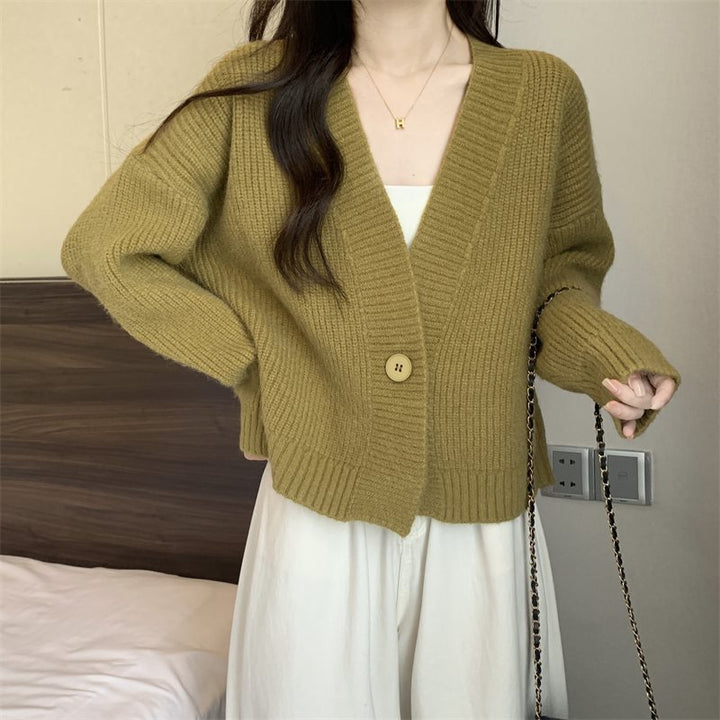 Kvinnenes løse cardigan med V-hals og store knapper Skjora