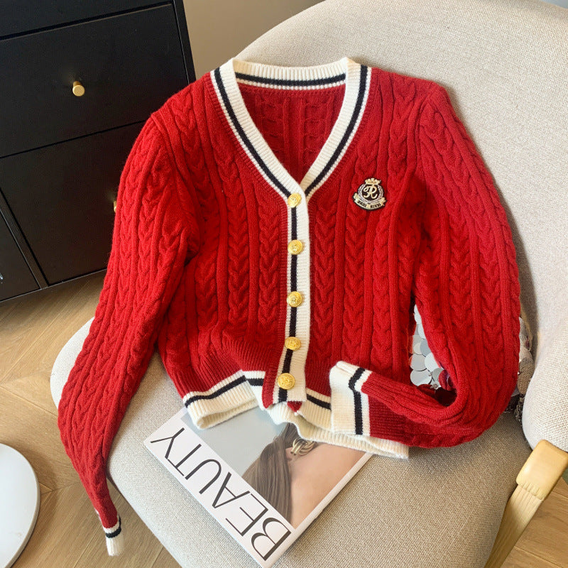 Dame chunky strikkegenser med dekorative knapper og sporty stripemønster Skjora