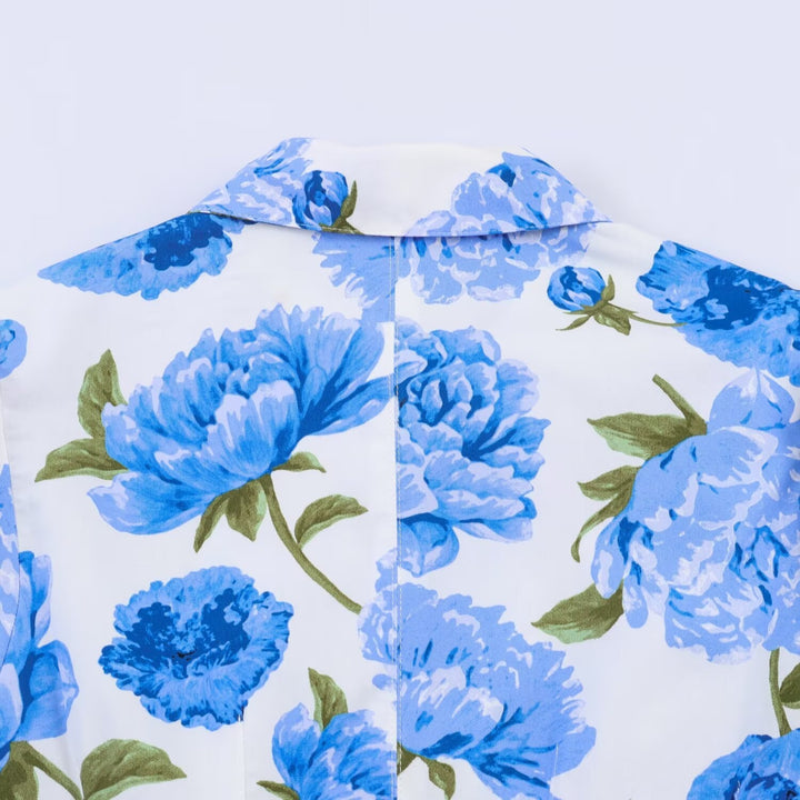 Damebluse med blomsterdesign og elegante puffermedeer Skjora