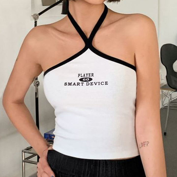 Dame cropped topp med asymmetrisk stroppeskjæring og grafikktrykk Skjora