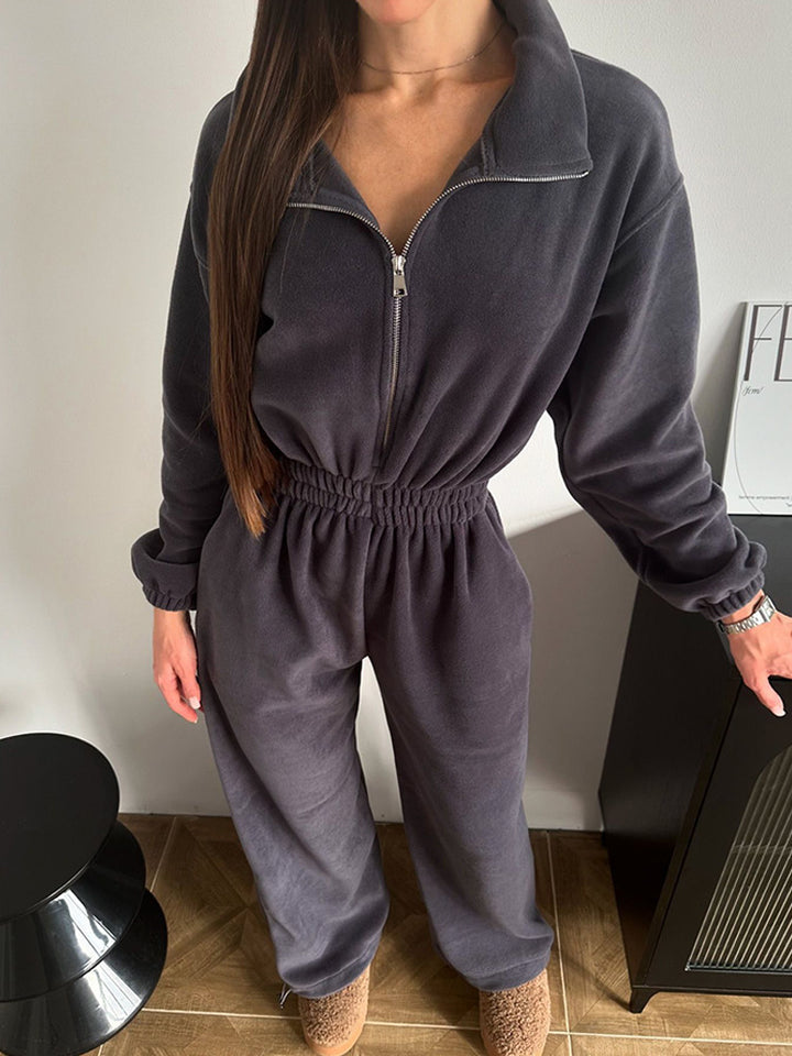 Kvinnelig stilren fleece treningsdrakt med halv glidelås og elastisk midjebånd Skjora