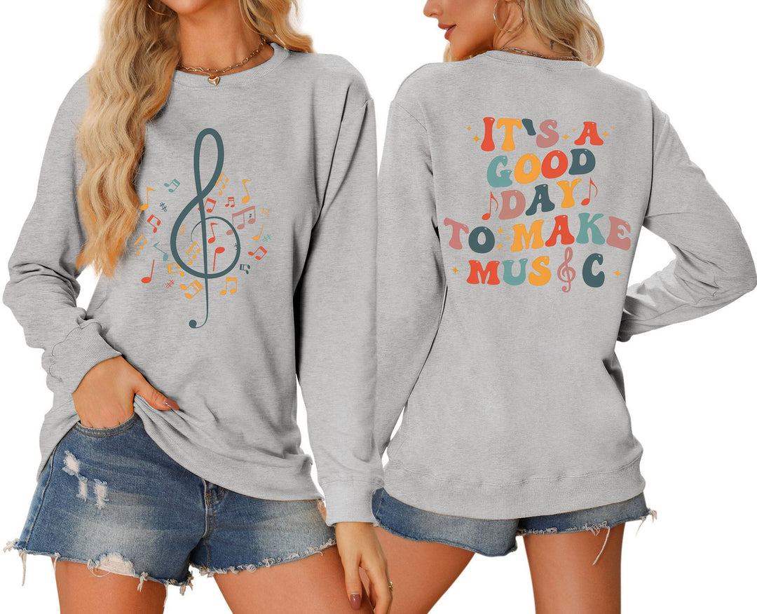 Dame sweatshirt med musikalsk motiv og kreativ skrift Skjora