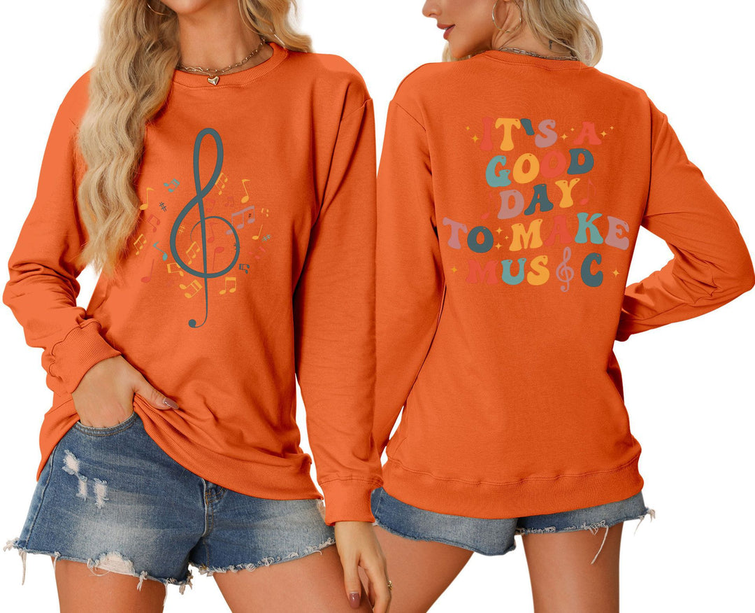 Dame sweatshirt med musikalsk motiv og kreativ skrift Skjora