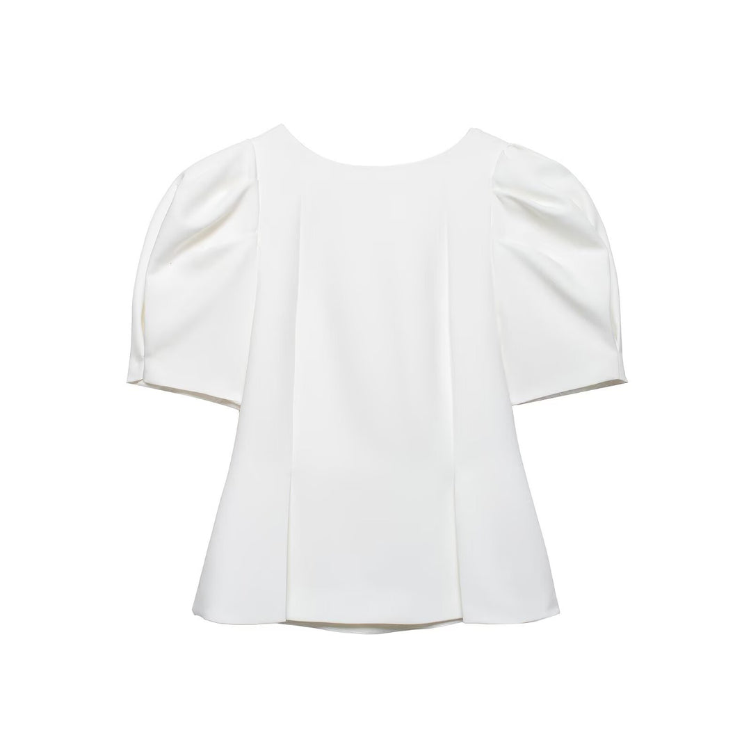 Damebluse med puffarmer og elegant snitt Skjora