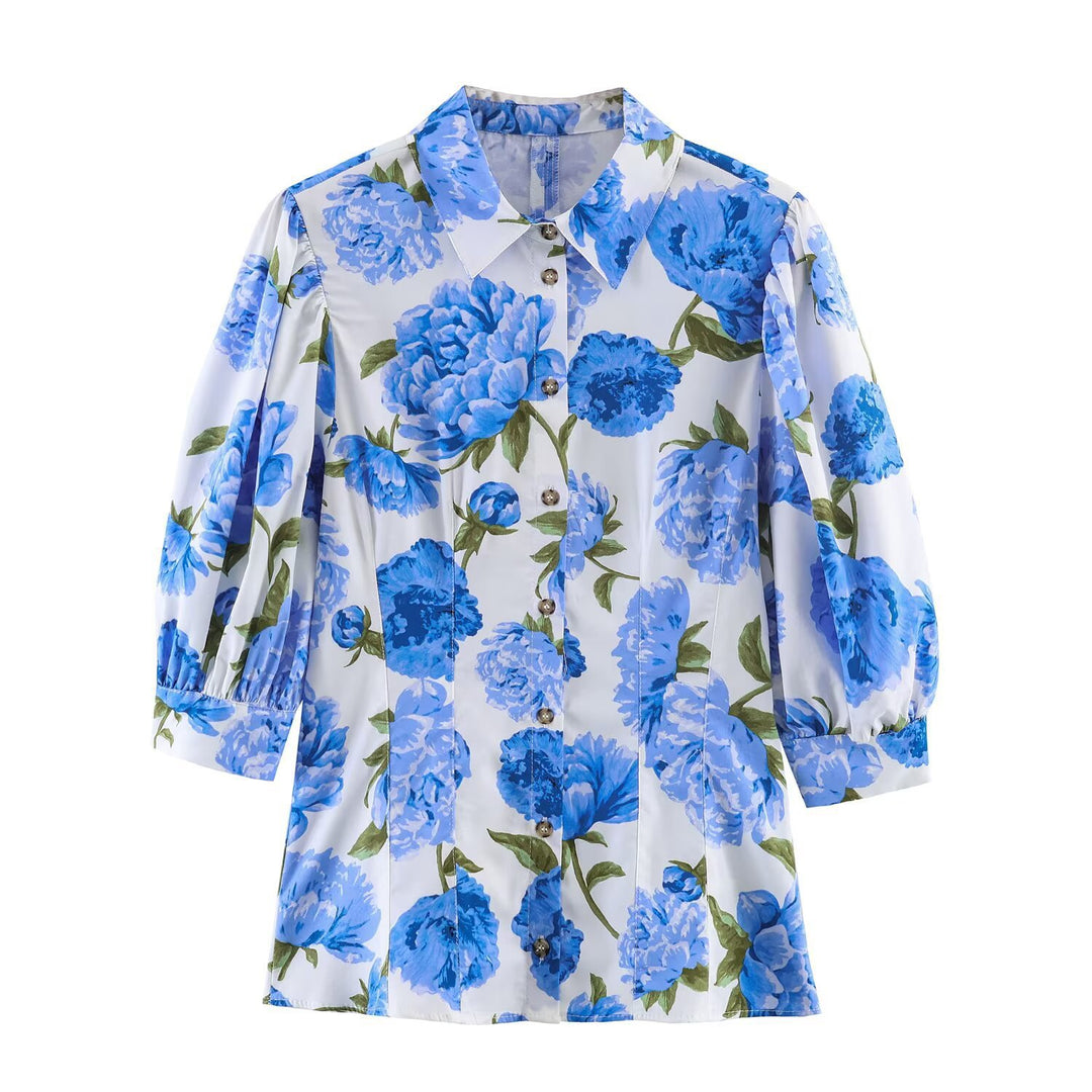 Damebluse med blomsterdesign og elegante puffermedeer Skjora