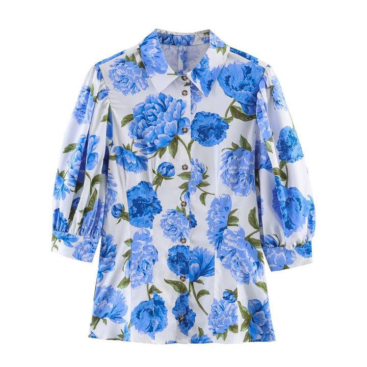 Damebluse med blomsterdesign og elegante puffermedeer Skjora
