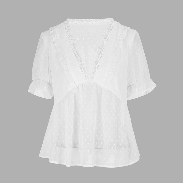Dame bluse med volangdetaljer og prikkedesign Skjora