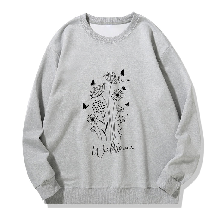 Kvinnelig sweatshirt med blomstertrykk av villblomster og koselig innerfor Skjora